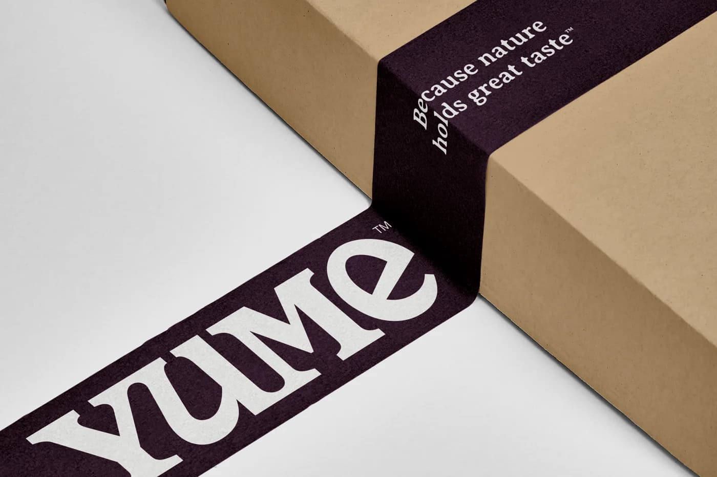 Yume branded packaging tape on a box